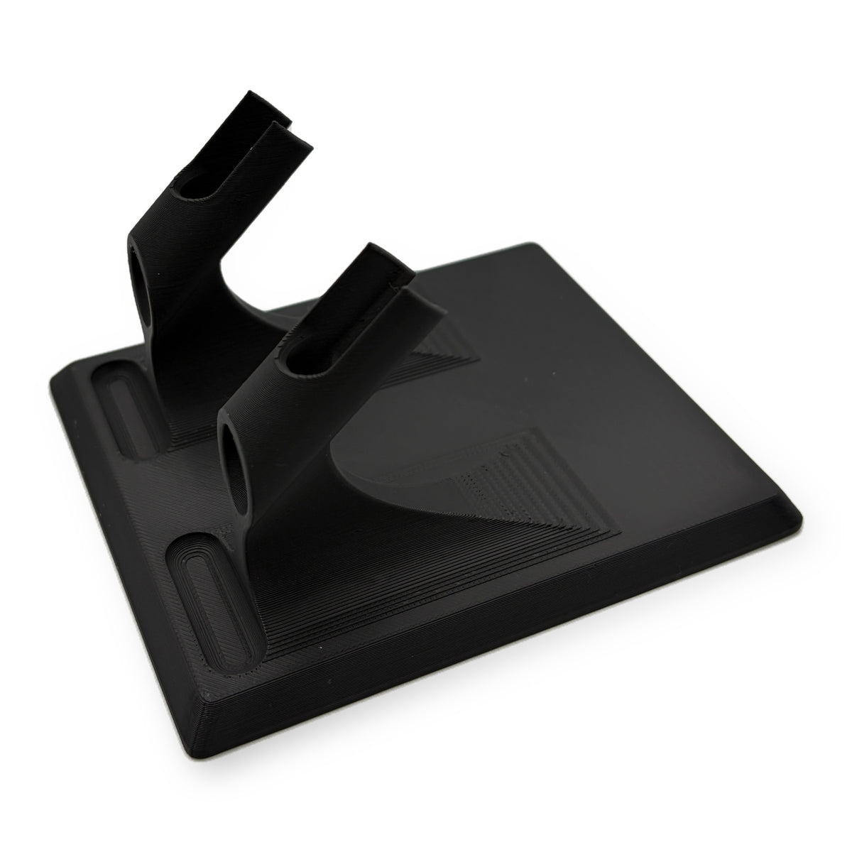 Two airbrush desktop stand in matte black, two angled cradles on a wide flat base