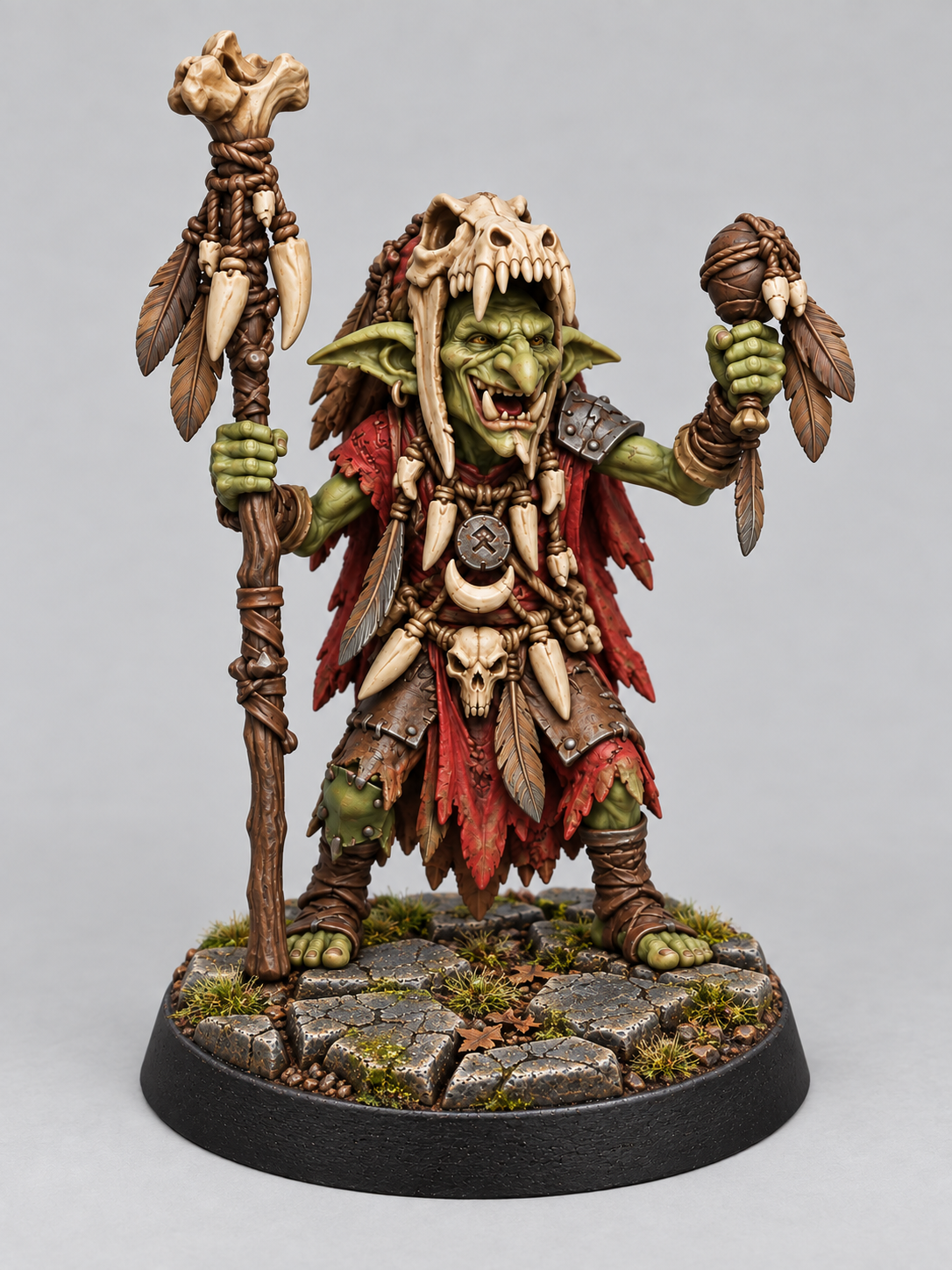 Goblin Shaman 3 painted green and red on a Broken Dungeonstone presentation base; supplied unpainted.